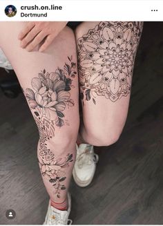 a woman's legs with tattoos on them and flowers in the bottom right leg