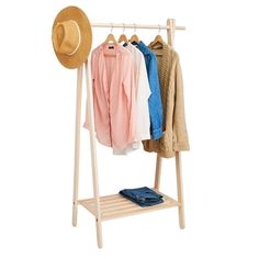 a clothes rack with hats and shirts on it