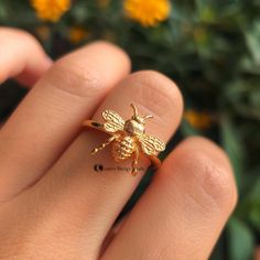 14K Gold Plated Honey Bee Ring, Dainty Honey Bee Ring, Bee Inspired Ring, Bumble Bee Stacking Ring, Delicate Honey Bee Ring ,Cute Bee Ring   💙ITEM DETAILS💙 ♥️ Item :  Honey Bee Ring ♥️ Material: 925 Silver ♥️ Size: Select the Variations ♥️ Stone: No                                               CUSTOME DESIGN JEWELS ♣️ NOTE:- Product color may be some different due to photographic lighting sources or your monitor setting. ♣️ Product & gemstone weight may vary from actual products. ♣️ Shown Products Are Purely Handmade, Please Provide Little Variations in Custom Orders. ♣️ Custom Orders Are Accepted. ♣️ All Products Are Designed & Manufactured In My Factory By Team. ♣️ We Are Perfect Choice For Any Custom Jewelry Manufacturing. ♣️ For Bulk Orders Please Message me. ♣️ PRODUCTION TIMES: Bee Themed Ring, Bee Jewelry Gold, Bumble Bee Jewelry, Sparkily Bee Jewelry, Bee Charm Jewelry, Fancy Accessories, Bee Ring, Bee Inspired, Bee Jewelry