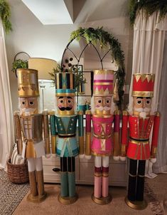 three nutcrackers are standing next to each other in front of a mirror