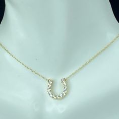 One 14k Yellow Gold Talisman Necklace, It Has A Thirteen (13) Round Brilliant Diamonds, Approx. 1.5mm, Channel Set On The Horseshoe Pendant. Combine Approx. 0.2ct, Being H-I Color And Si2-I Clarity. The Horseshoe Is 12.0 X 11.0mm. The Necklace Is 17.5" Long, Weight 1.6gm, Hallmark 14k (1 Inch = 25.4 Mm; 1 Dime = 17.9mm). All Items Are Pre-Owned Unless Otherwise Stated. This Means They Have The Usual Aspects Of Pre-Owned Jewelry, Such As Light Scratches, Wear And Tarnish. Please Review All The Ph Horseshoe Jewelry, Horseshoe Pendant, Talisman Necklace, Channel Set, Brilliant Diamond, Round Brilliant, Womens Jewelry Necklace, Beautiful Jewelry, 1 Inch