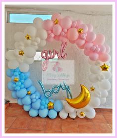 a balloon arch with stars and moon on it