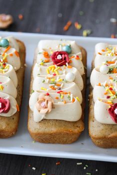 four pieces of bread with frosting and sprinkles