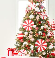 a christmas tree decorated with red and white ornaments