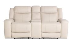 a white leather reclining sofa with two seats on the back and one arm facing forward