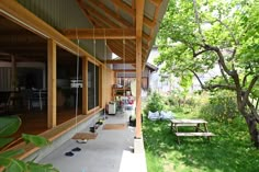 the porch is covered with wooden slats