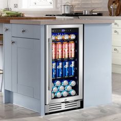 a beverage cooler sitting in the middle of a kitchen