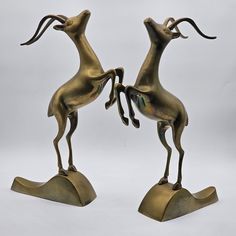 Graceful Vintage Brass Gazelle Statues - Mid Century Modern Decor - Set Of 2 - 13". Add A Touch Of Mid-Century Charm To Your Home Decor With This Stunning Set Of 2 Vintage Solid Brass Gazelle Statues. These Leaping Gazelle Statues Are Beautifully Sculpted In A Modern Mid-Century Style, Offering A Timeless Elegance To Any Space. Made From High-Quality Solid Brass, These Statues Are Not Only Visually Striking But Also Durable And Long-Lasting. Perfect For Adding A Touch Of Sophistication To Your Living Room, Office, Or Entryway, These Vintage Statues Are Sure To Be A Conversation Starter. Elevate Your Space With These Unique And Eye-Catching Pieces That Capture The Essence Of Mid-Century Moder Vintage Statues, Brass Statues, Modern Mid Century, Mid Century Modern Decor, Nature Decor, Mid Century Modern Design, Mid Century Style, Living Room Office, Room Office