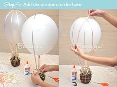 the balloon is being made into a vase with balloons attached to it, and then tied together