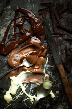 melted chocolate and spoons laying on the ground