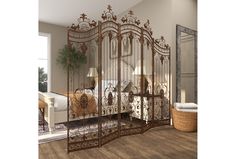 an ornate iron gate in a bedroom with hardwood floors