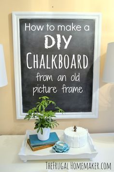 a chalkboard on the wall above a table with a cake and potted plant