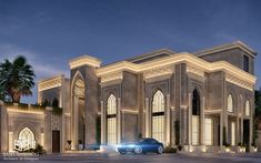 a blue car is parked in front of a large building at night with palm trees