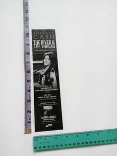 the ruler is next to an advertisement for cash and the river & the threadd