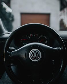 the steering wheel and dashboard of a volkswagen car