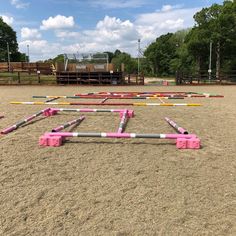 several pink and white pipes laying on the ground