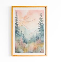 a painting hanging on the wall above a wooden frame with watercolor trees and mountains