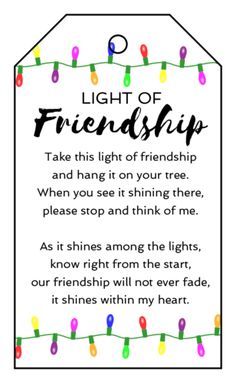 a card with the words, light of friendship and lights strung from strings on it