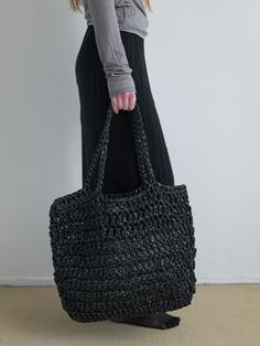 NOTHINGEVERYTHING is a brand that experiments with the diversity of materials.- This is a handmade knit big bag- Used two different textured materials- Used  polypropylene, an eco-friendly plastic material- Can be worn as a shoulder or tote bag Black Woven Plastic Bag, Modern Black Rectangular Straw Bag, Modern Black Straw Bag For Shopping, Modern Black Woven Bag, Eco-friendly Black Bags With Braided Handles, Modern Black Handwoven Bag, Black Crochet Bag With Braided Handles For Shopping, Modern Black Shoulder Bag For Beach, Handmade Black Tote Beach Bag