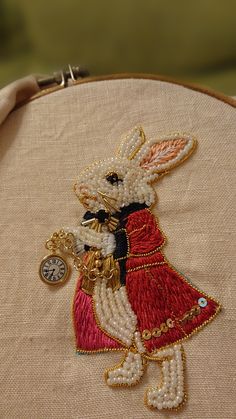 a close up of a small embroidered animal