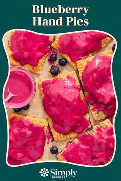 blueberry hand pies with raspberry sauce on top