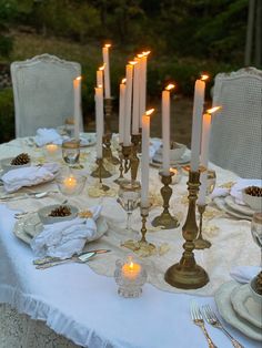 Candlelight, tablescape, romantic tables, outdoor dining, French country, gatherings, dinner party, table decor, European farmhouse White Chairs White Tablecloth Wedding, Dinner Party Aesthetic Vintage, Fancy Dinner Party Table Decor, Aesthetic Wedding Food Table, Outdoor Dinner Aesthetic, Fairytale Wedding Venue Aesthetic, Classy Eclectic Decor, Antique Party Theme, Meditterean Wedding