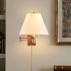 a lamp that is next to a book shelf