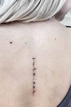 the back of a woman's neck with an inscription on it that says, i love