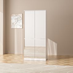 a white cabinet sitting in the middle of a room next to a painting on the wall