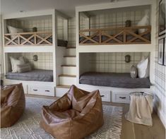 a room with bunk beds and bean bag chairs