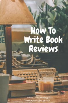 an old fashioned typewriter sitting on top of a table next to a lamp with the words how to write book reviews