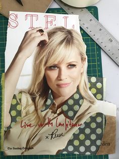 a magazine cover with a woman's face on it next to a ruler and scissors