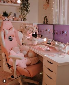 a pink chair sitting in front of a computer desk