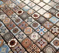 an assortment of different colored and patterned tiles