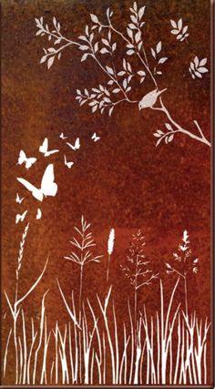 a metal wall hanging with butterflies flying over grass and flowers in the air, on an orange background