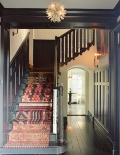 an instagram page with stairs and rugs on the floor in front of a door