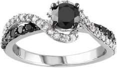 a black and white diamond engagement ring with an oval center stone surrounded by round diamonds