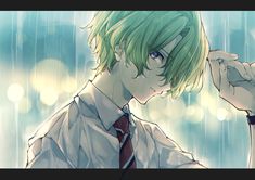 a man with green hair and tie holding his hand up to his face while standing in the rain