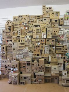 many cardboard boxes stacked on top of each other