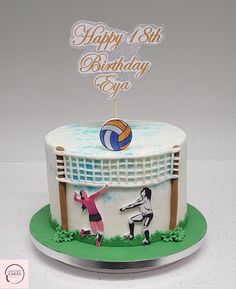 a birthday cake with two people playing volleyball