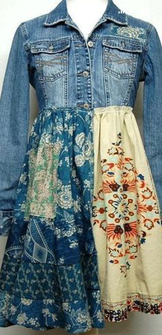 a dress and jean jacket sitting on top of a mannequin