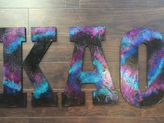 the letters are made out of colorful paint