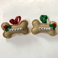 two dog bone magnets with bows on them