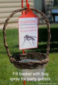 a basket with a sign attached to it that reads, warning for mosquitos in hanging basket