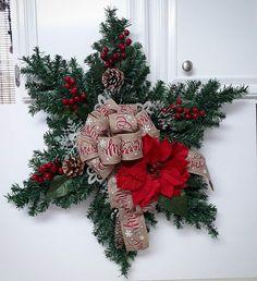 a christmas wreath hanging on the front door