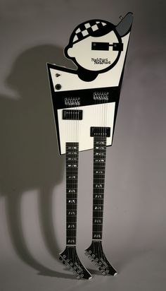 a guitar shaped like a man with two legs