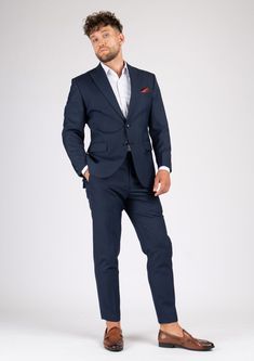 The Bryant Navy Sharkskin Suit is the perfect choice for any smart occasion. Crafted with a luxurious navy sharkskin fabric and custom made for a premium appearance, it has a deep blue color, a stylish and modern cut, and will make you look and feel confident. Navy Fitted Double Breasted Suit With Notch Lapel, Navy Double-breasted Suit With Notch Lapel, Navy Fitted Three-piece Suit For Office, Fitted Navy Three-piece Suit For Office, Luxury Fitted Navy Tuxedo, Formal Fitted Navy Three-piece Suit, Luxury Fitted Navy Blazer, Navy Fitted Tuxedo, Navy Fitted Tuxedo In Suiting Fabric