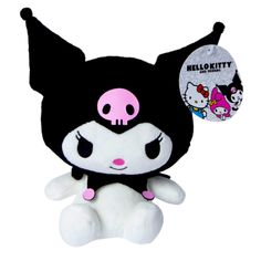 a black and white stuffed animal with pink eyes