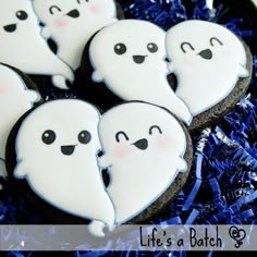 cookies decorated with white icing and spooky eyes