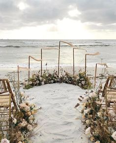 an instagram photo with chairs and flowers on the beach